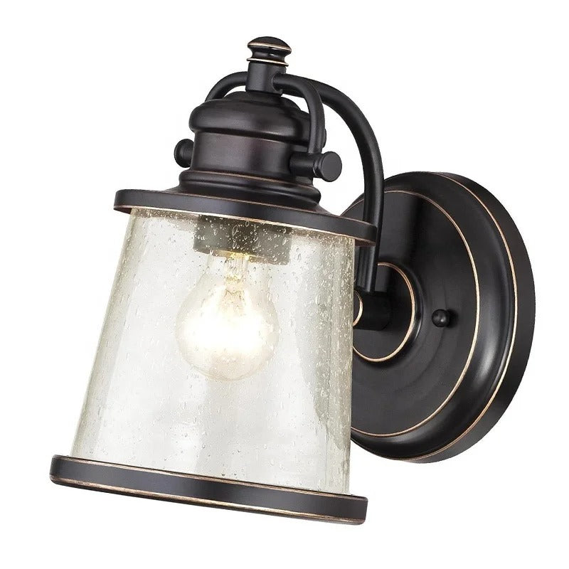 Brązowa lampa ścienna z przezroczystym kloszem z nasionkowego szkła