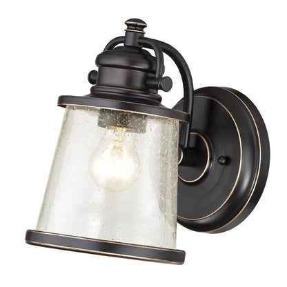 Brązowa lampa ścienna z przezroczystym kloszem z nasionkowego szkła