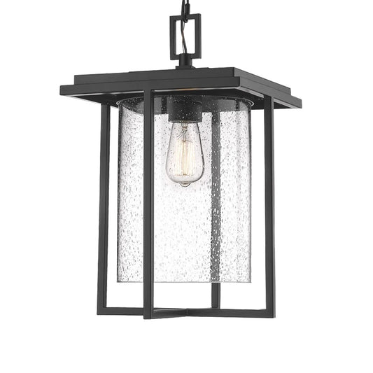 Czarna wisząca latarnia z prostokątną ramą i cylindrycznym kloszem z nasionkowego szkła